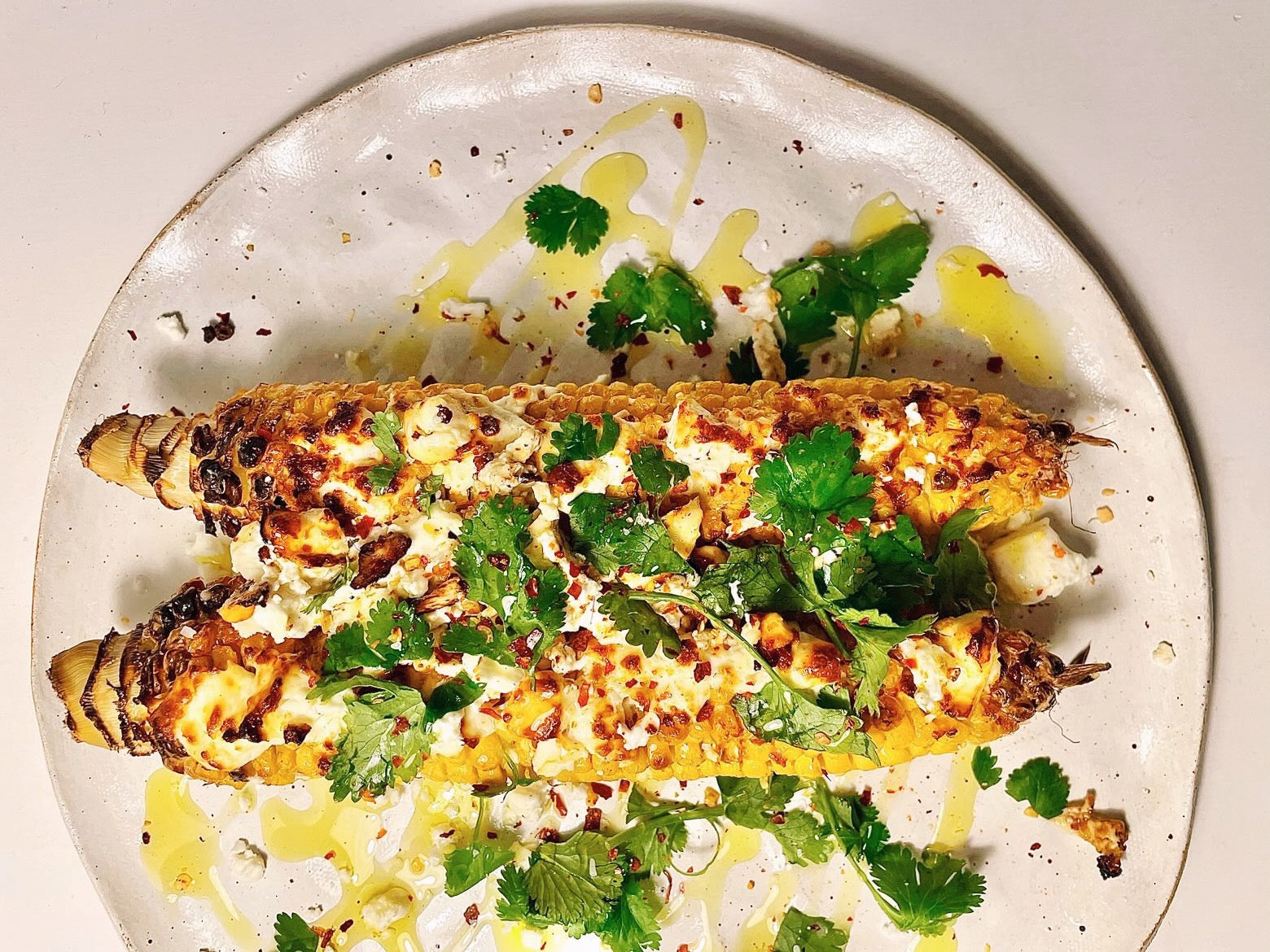 corn with extra virgin olive oil and fresh herbs