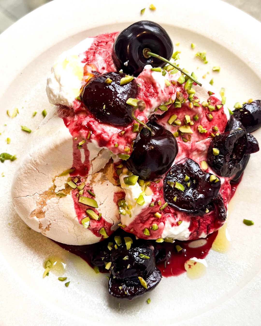Cherry pavlova with olive oil