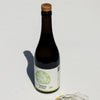 Citizens of Soil extra virgin olive oil in a dark glass bottle with a cork stopper, set against a plain white background with a soft shadow.
