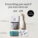 Olive oil product set with bottle, packaging, and card on a light background